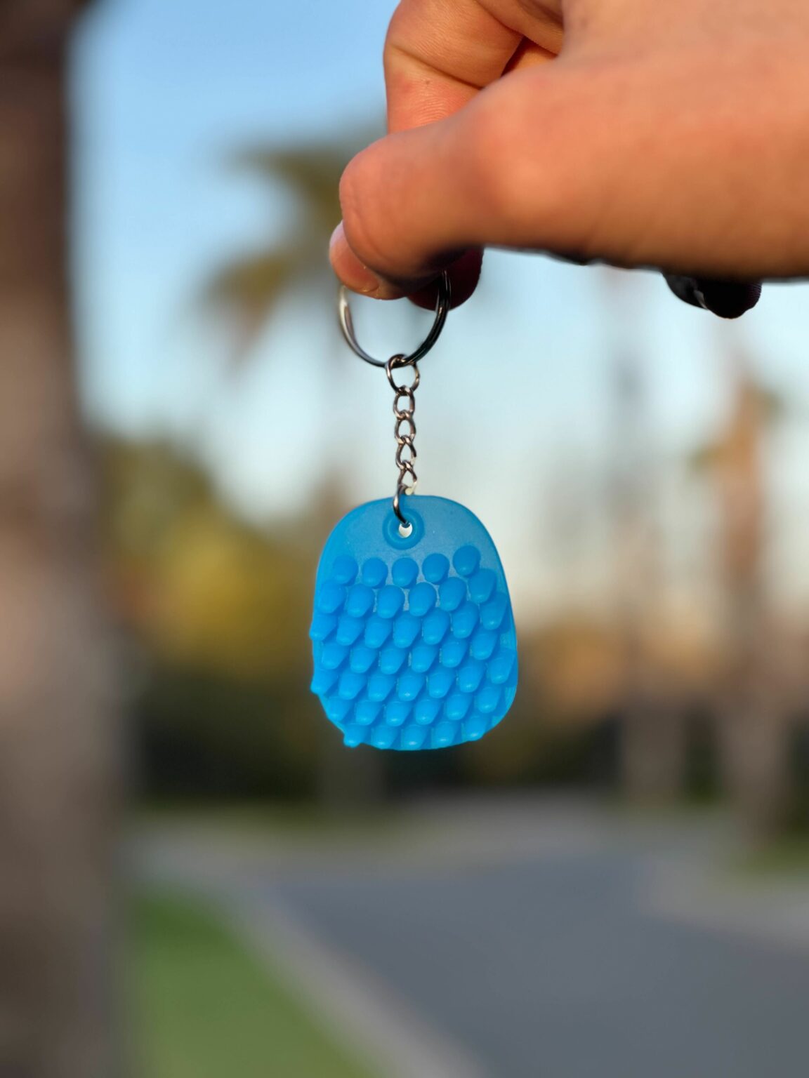 A portrait of blue keychain fidget.